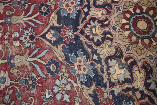 A Persian blue ground carpet, 17ft 11in by 10ft 1in.